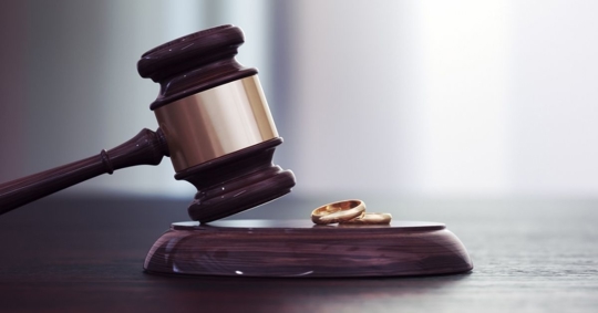 gavel and rings on a table