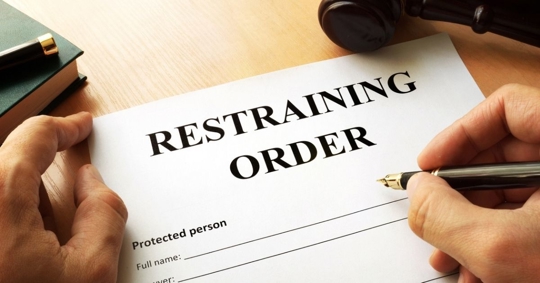 restraining order document on a table